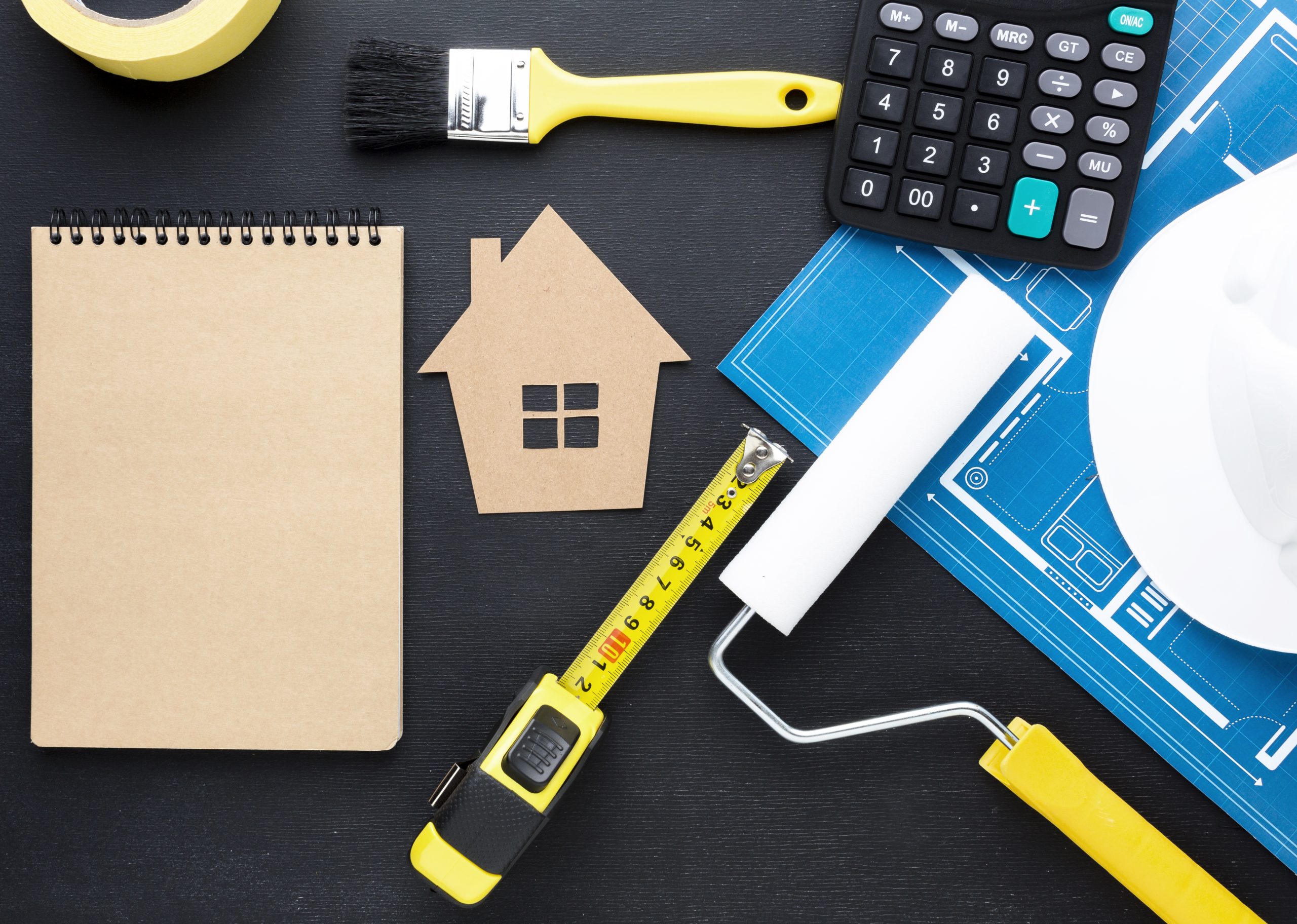 blue-print-house-with-tools-empty-notepad-scaled